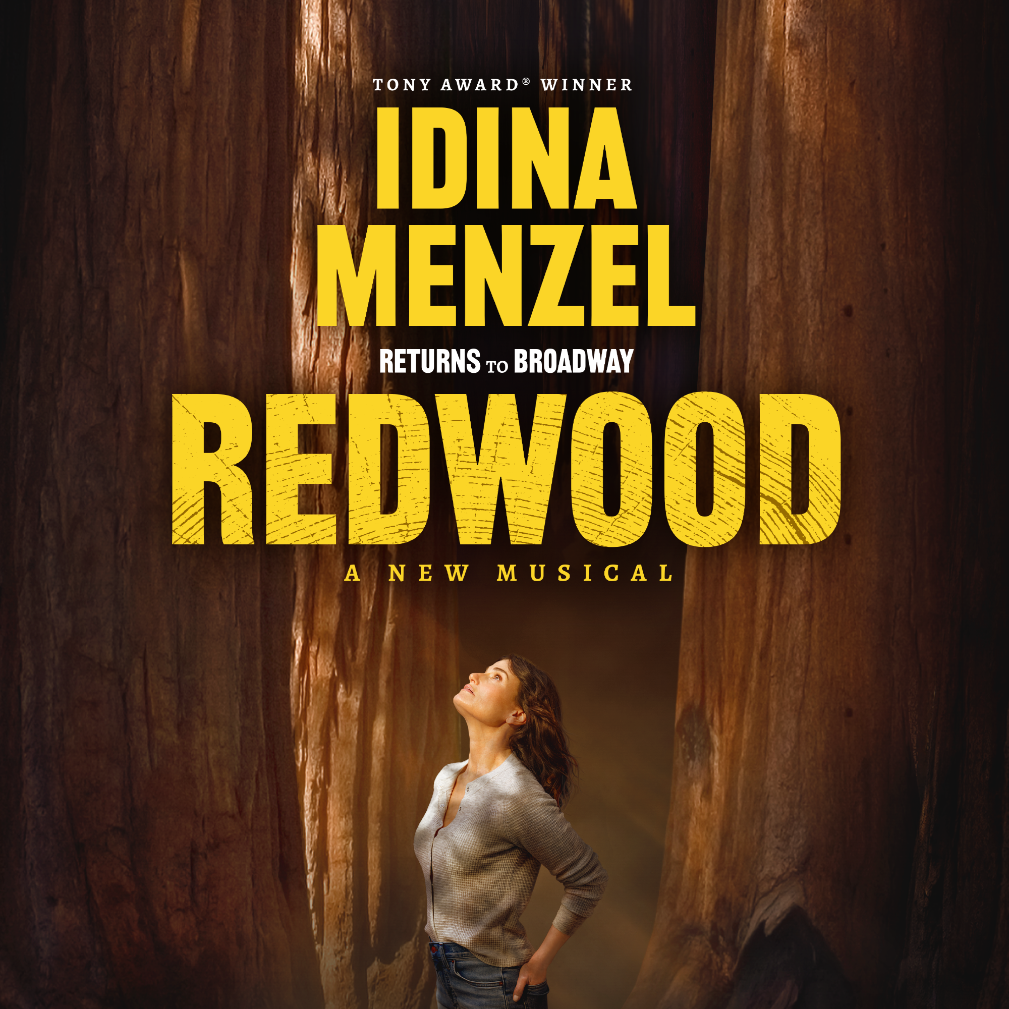 Artwork for REDWOOD, Idina standing among redwood trees gazing up at text that reads Tony Award Winner Idina Menzel Returns to Broadway in Redwood A New Musical.